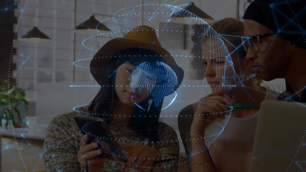 Tablet operator tapping and creating rotating hologram, colleagues leaning in analyzing tech data
