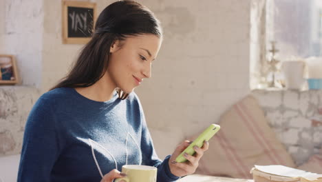 young student using smart phone at home in  morning drinking coffee