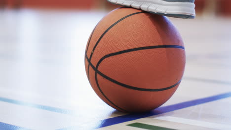 close-up of a basketball on the court, with copy space