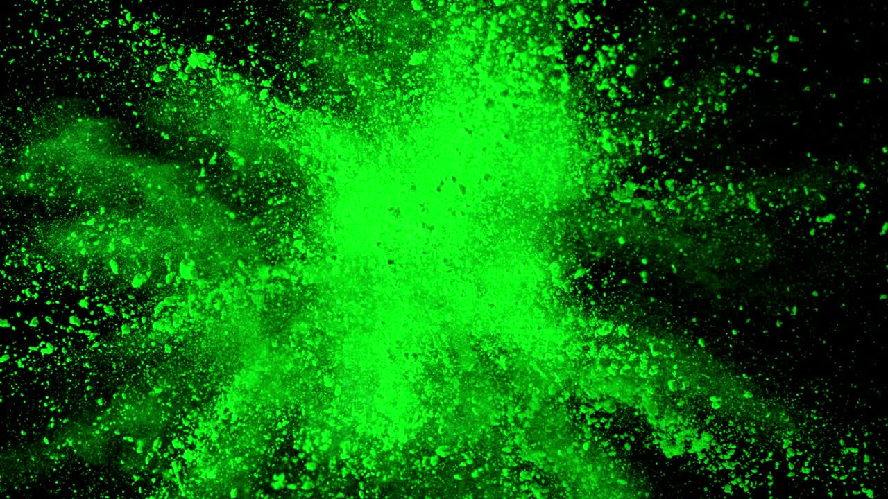 super cámara lenta de la explosión de polvo de color aislado en el fondo oscuro.