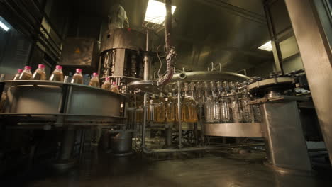 automated bottle filling and capping machine in a production facility