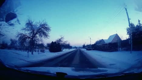 Driving-a-car-with-a-frozen-windshield-over-the-town