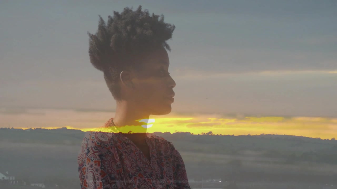 Vertical video: Woman turning left after gaze for cinematic portrait, sun band crossing chest