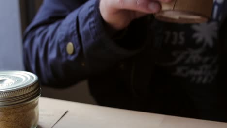 man drinking a cup of coffee