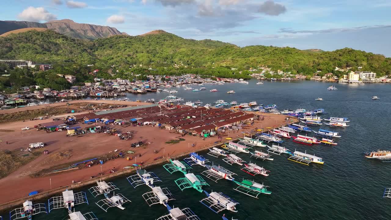 Outrigger Boats (bancas) At Coron Town Fishing Village In Palawan, Philippines. Aerial Drone Shot