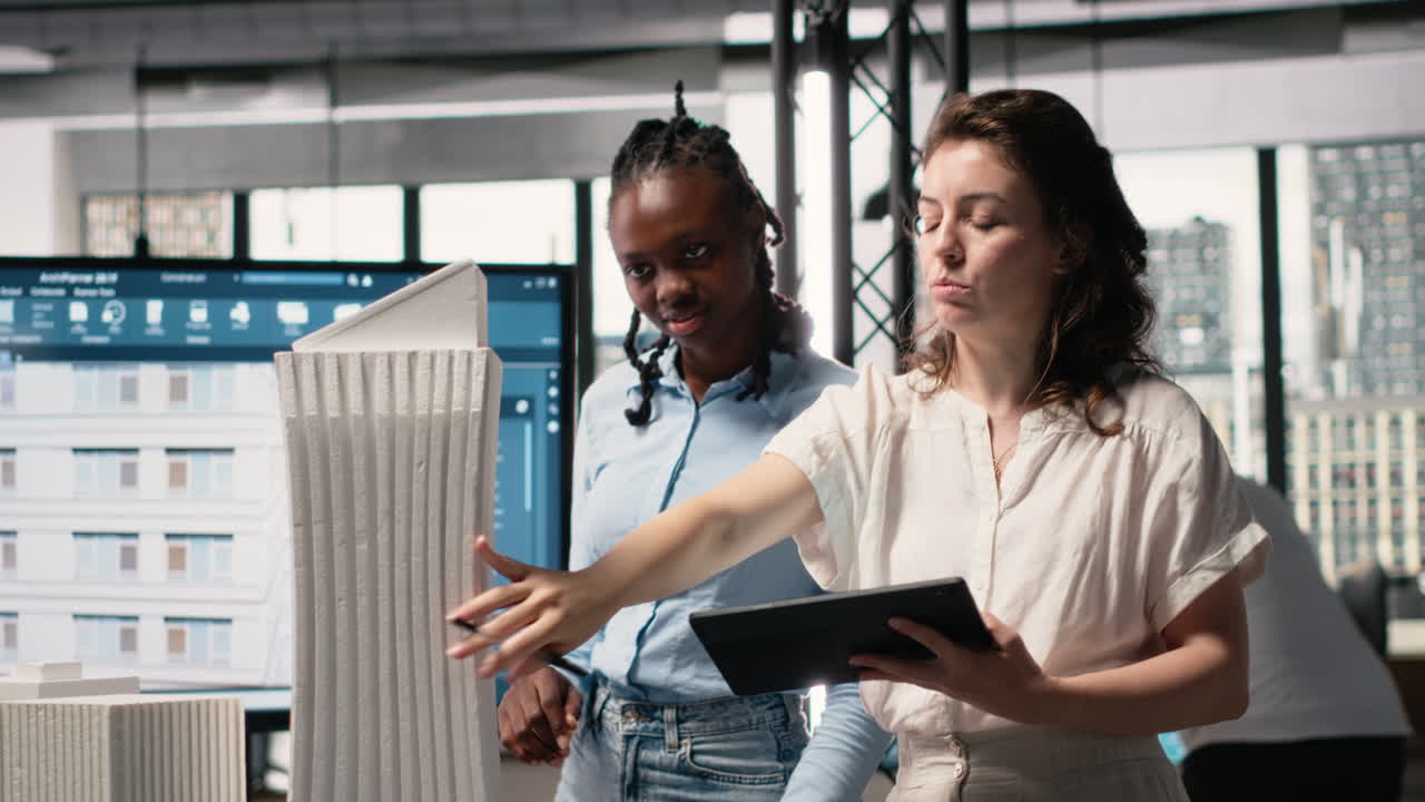 Vertical Video Diverse female contractors sharing structural layout ideas for residential area