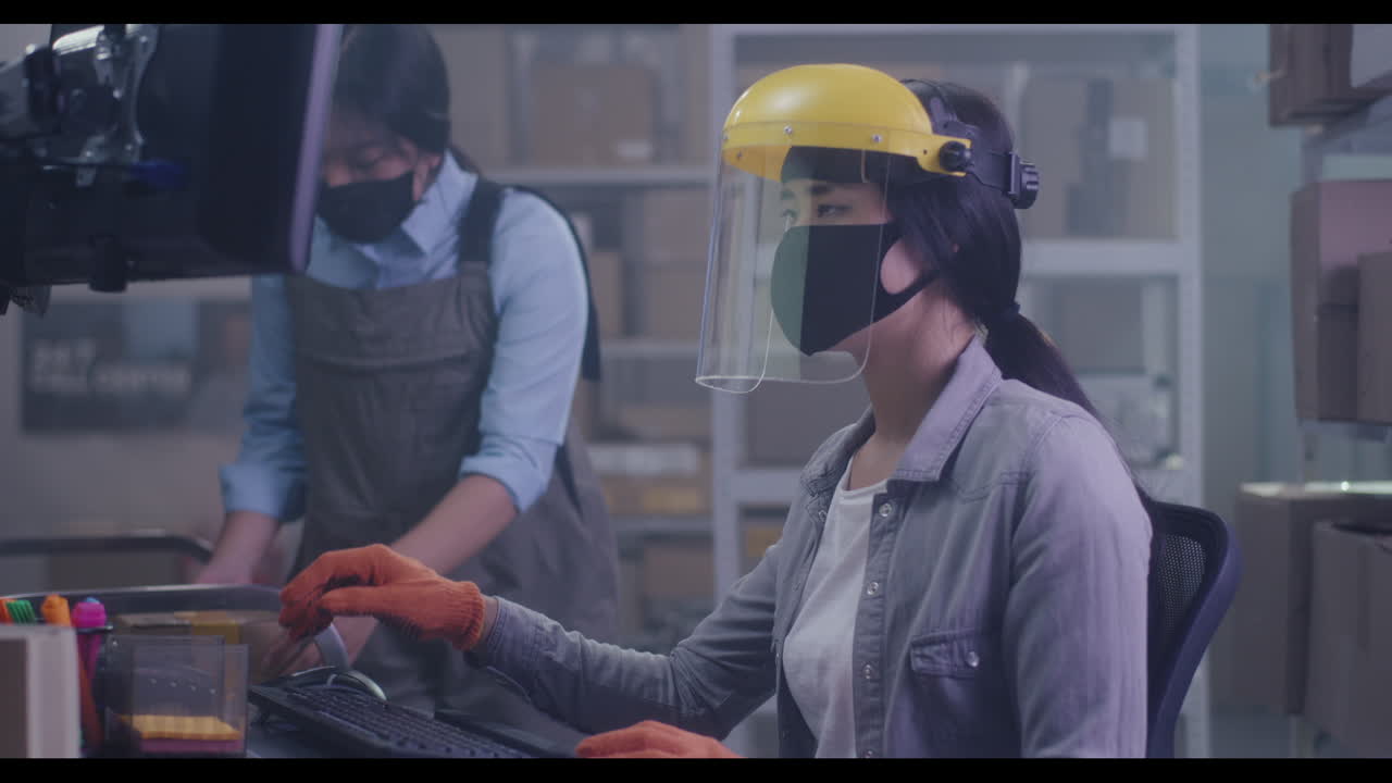 Warehouse Employees Working in Protective Gear