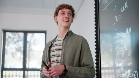 man teaching math in a classroom