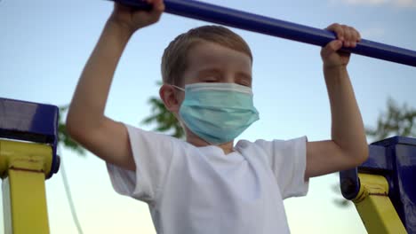 a teenage boy in a medical mask is engaged in sports 09