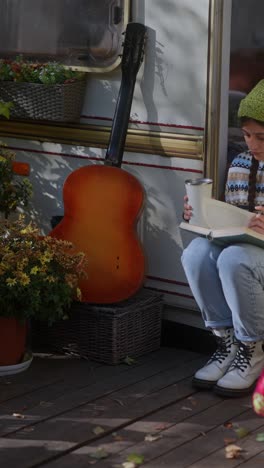 cozy autumn reading by the camper