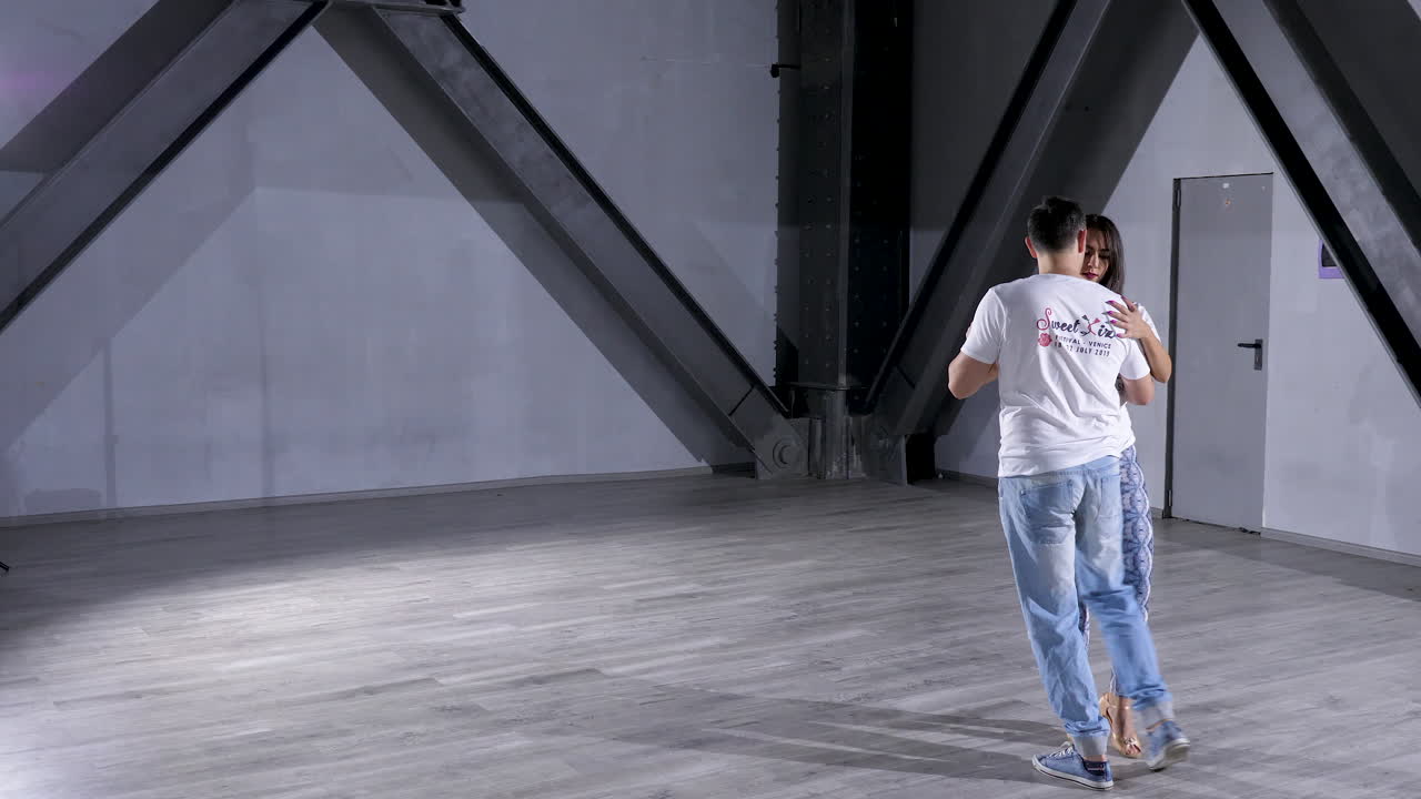 Couple dancing indoors