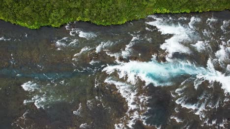 iconic bruarfoss waterfall and flowing river in iceland, aerial drone view