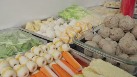 set of traditional shabu-shabu dishes, various boiled ingredients of meat and vegetables