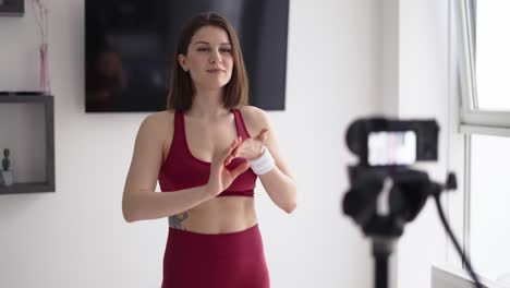 woman fitness instructor records a tutorial at home, introduction