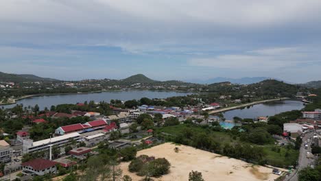 aerial shot of beach and coastal city forward panning shot