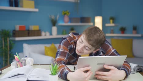 The-student-studying-at-home-hugs-his-laptop-with-joy.