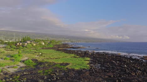 The-rocky-coastline-of-Kailua-Beach-where-beautiful-ocean-side-homes-sit-during-sunset