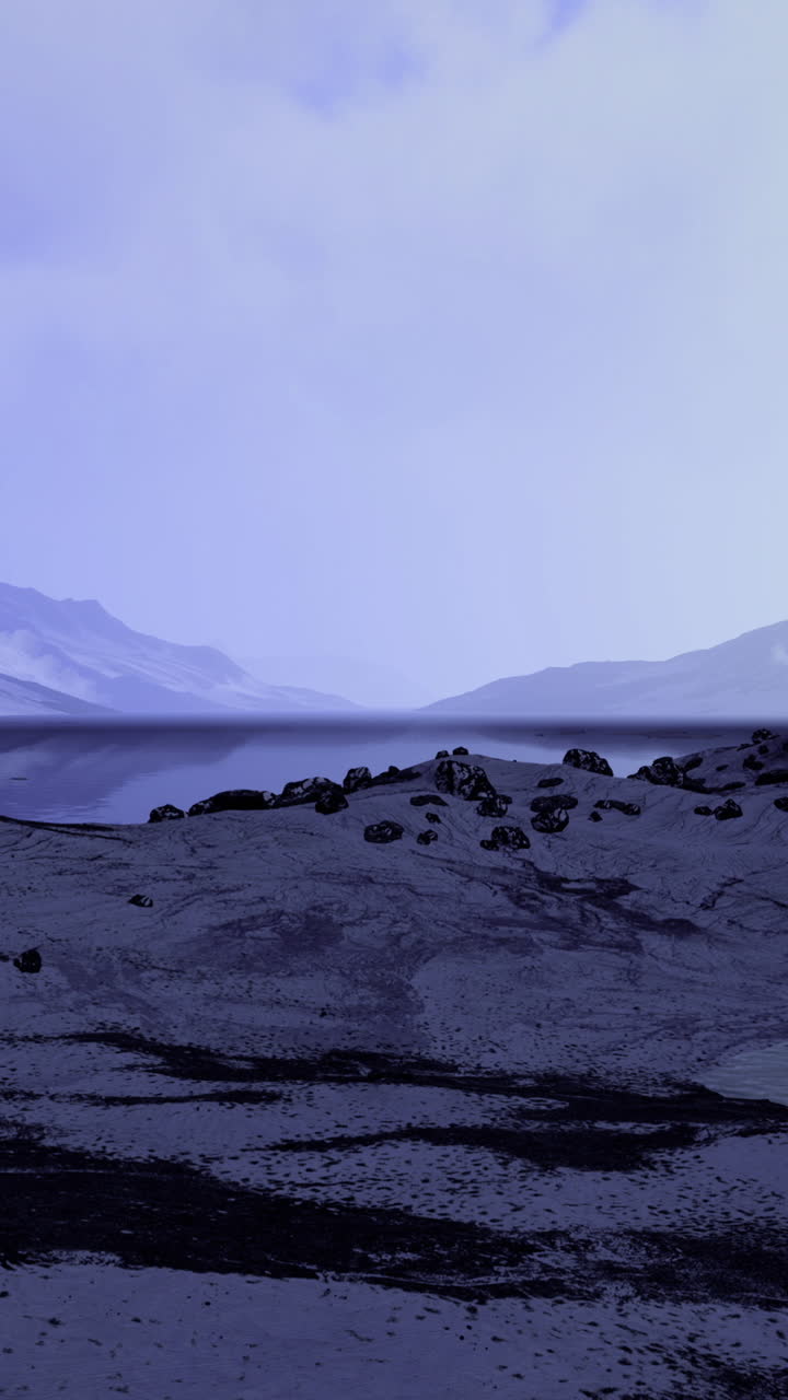 Majestic mountains rise under twilight skies with serene lakeside reflections