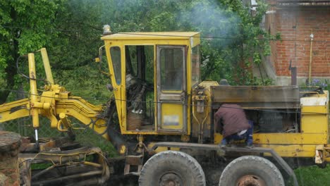 man starts the construction bulldozer
