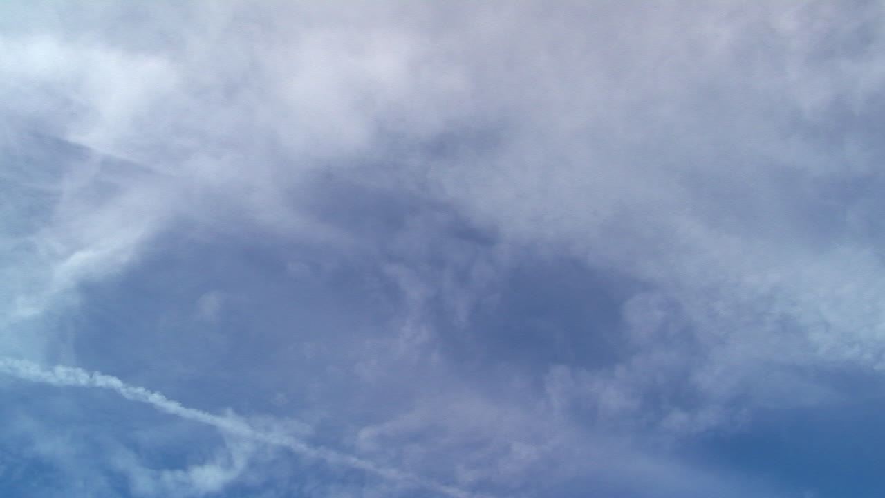 Clouds and vapor trails in time-lapsed motion