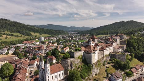 aerial - historic town of Aarburg with hilltop fortress and Aare River in canton Solothurn Switzerland