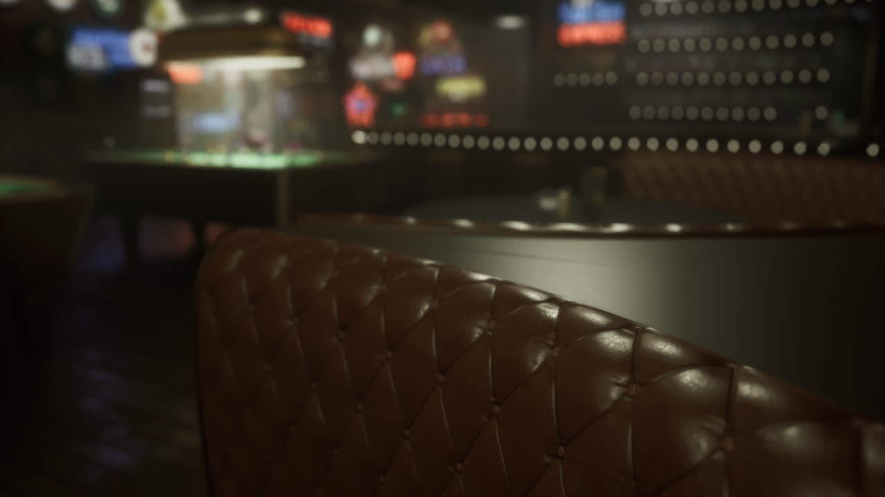 Cozy leather seating in a dimly lit lounge with pool table in background
