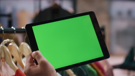 man hands typing mockup tab computer at shop closeup. store worker using tablet