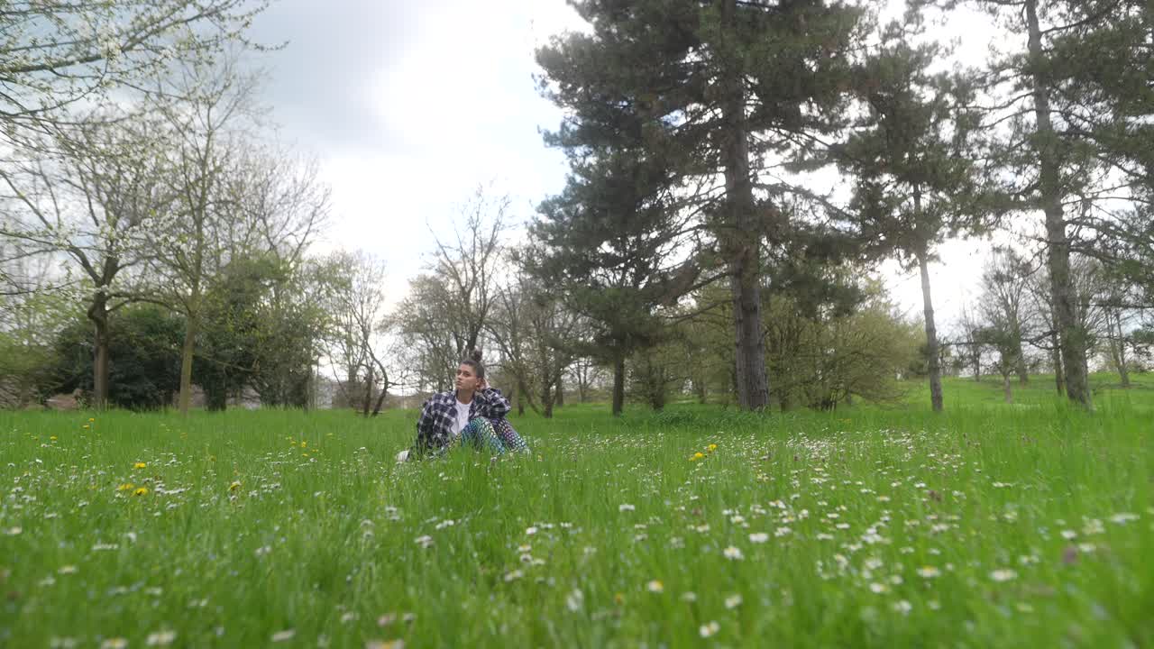 Woman Relaxing in a Spring Park