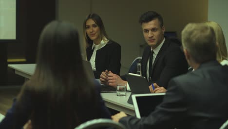 the business people are discussing strategy at the business conference