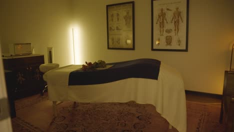 a panning shot of the soothing ambiance of a massage room with relaxing décor