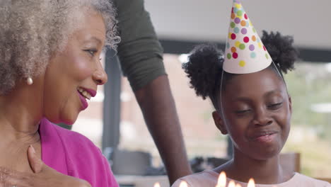 family singing happy birthday for their senior relative