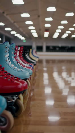 colorful roller skates in a row at an indoor rink