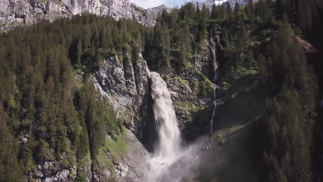 Big-Waterfall-Reverse-Up-High-Drone-Flight-Up-Stäubifall-Bei-Äsch-Kanton-Uri-Switzerland-4k