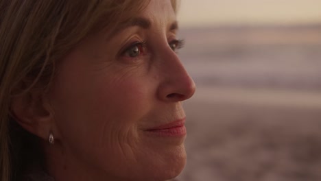 active senior woman sitting on beach