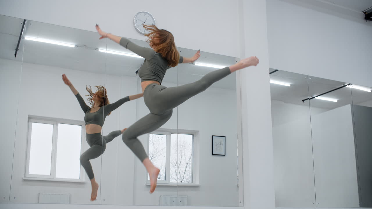Woman practicing dance moves in a studio