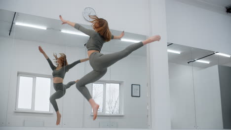 woman practicing dance moves in a studio