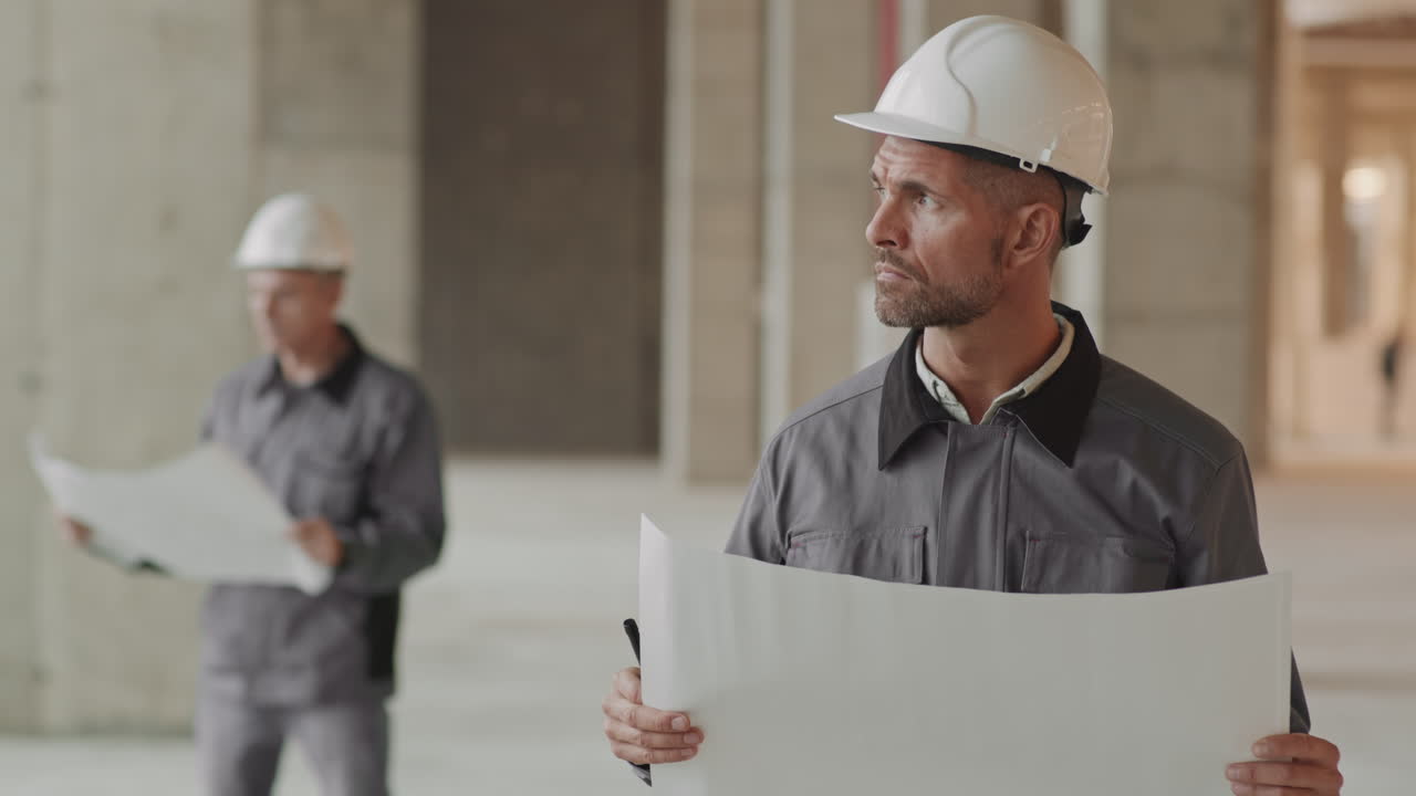 Caucasian Builder Posing with Paper