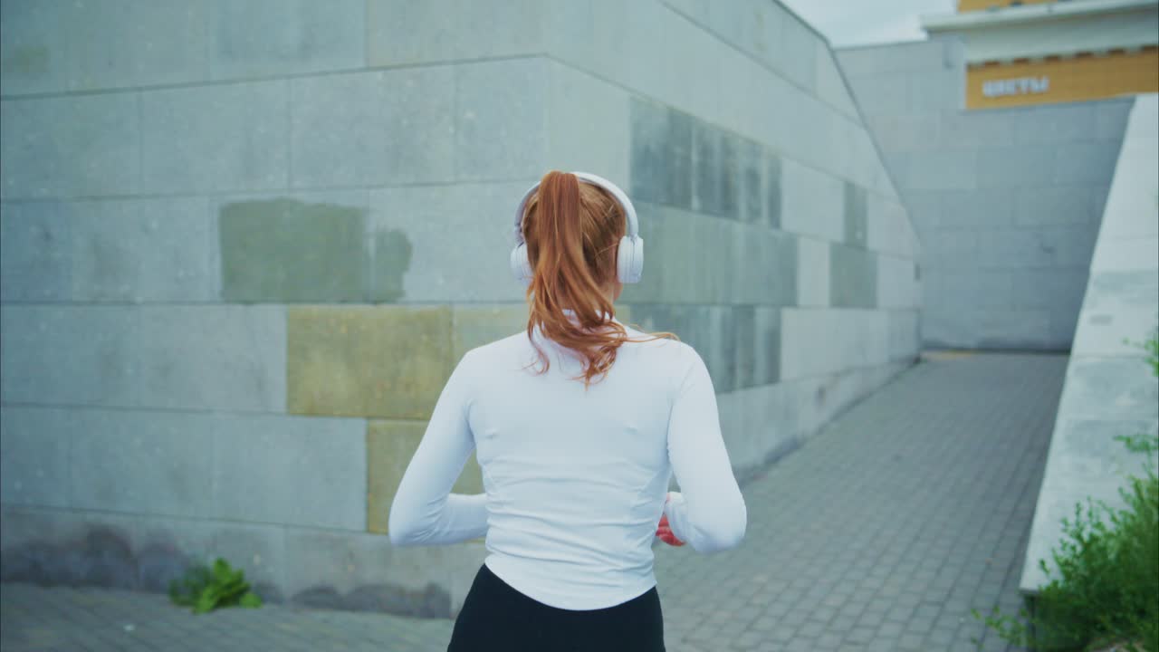 Redhead Woman Jogging Outdoors