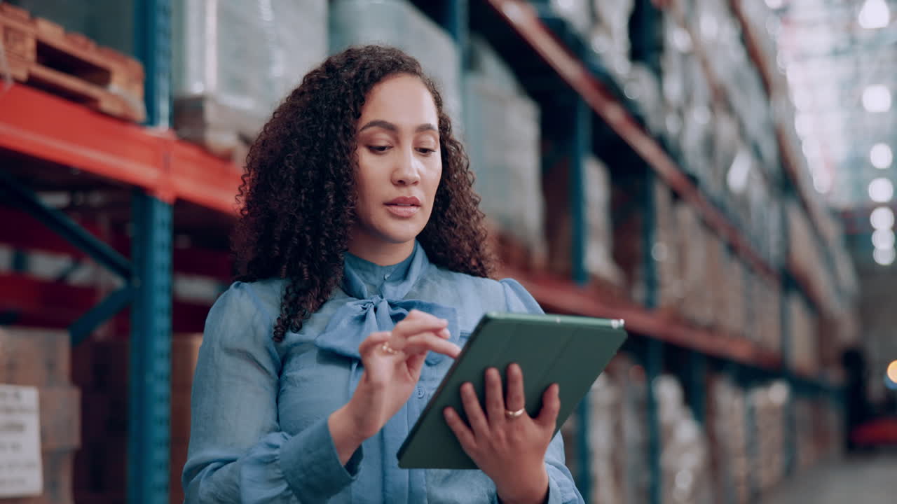 Woman Checking Inventory in Warehouse