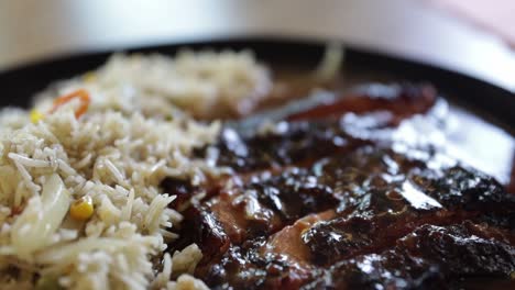 plate full of rice and slow cooked beef ribs