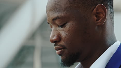 close-up profile of a thoughtful black businessman
