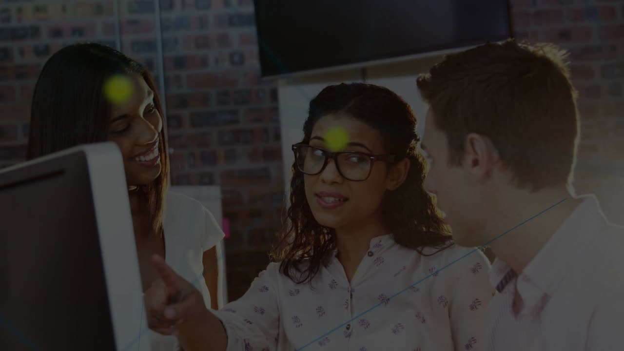 Center woman reaching monitor and explaining tech for team in office, overlays moving toward team