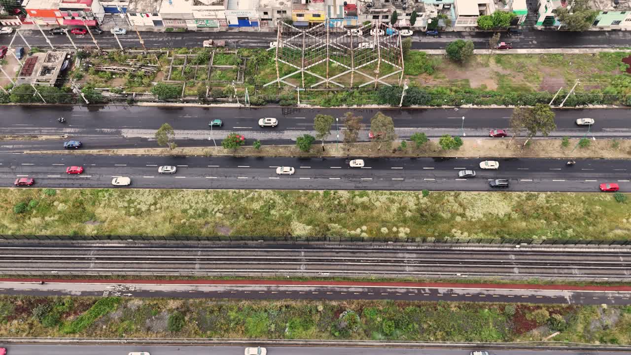 Busy avenue in Ecatepec with constant traffic on a rainy day