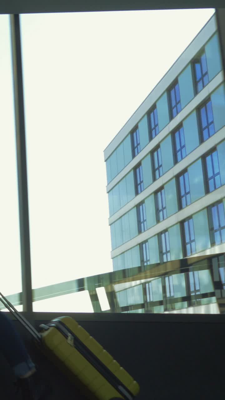 Woman traveling with luggage in airport