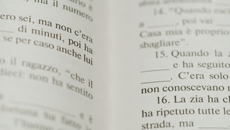 close-up of a book page with italian text and exercises