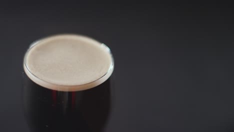 close up of pint of irish stout in glass to celebrate st patricks day 11