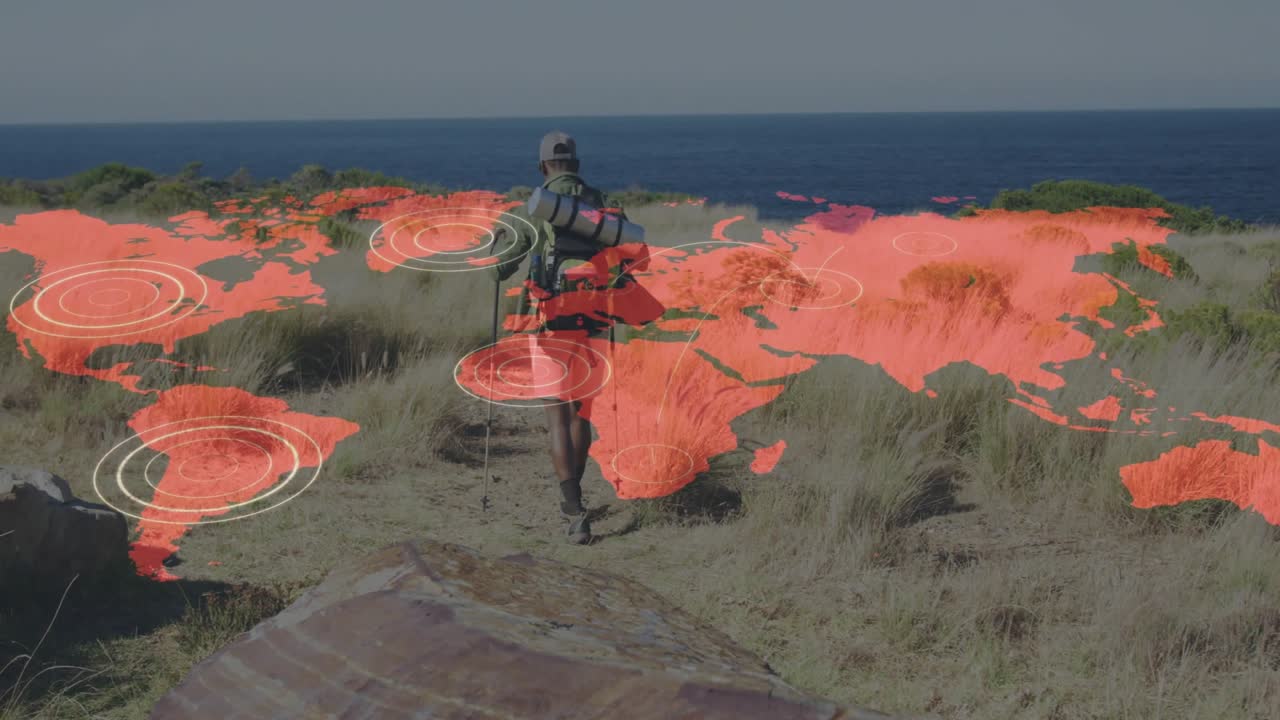 Hiker holding poles and stepping forward triggers world map pulses showcasing tracking technology