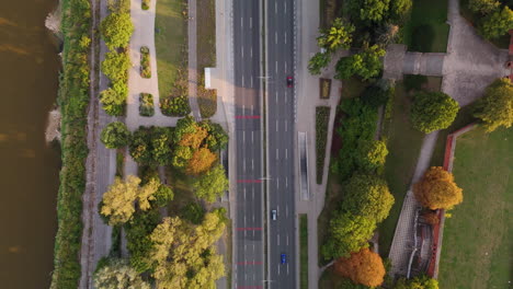 aerial view of city park and riverfront road