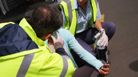 Patient-receiving-oxygen-mask-from-ambulance-team