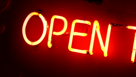 panning of open tonight red neon sign